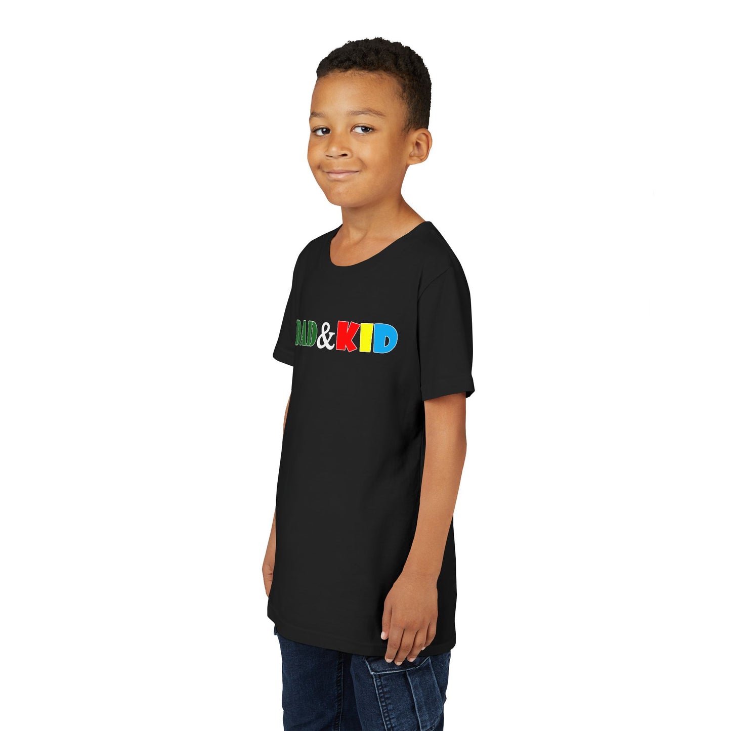 Child wearing a black t-shirt with colorful text on a white background