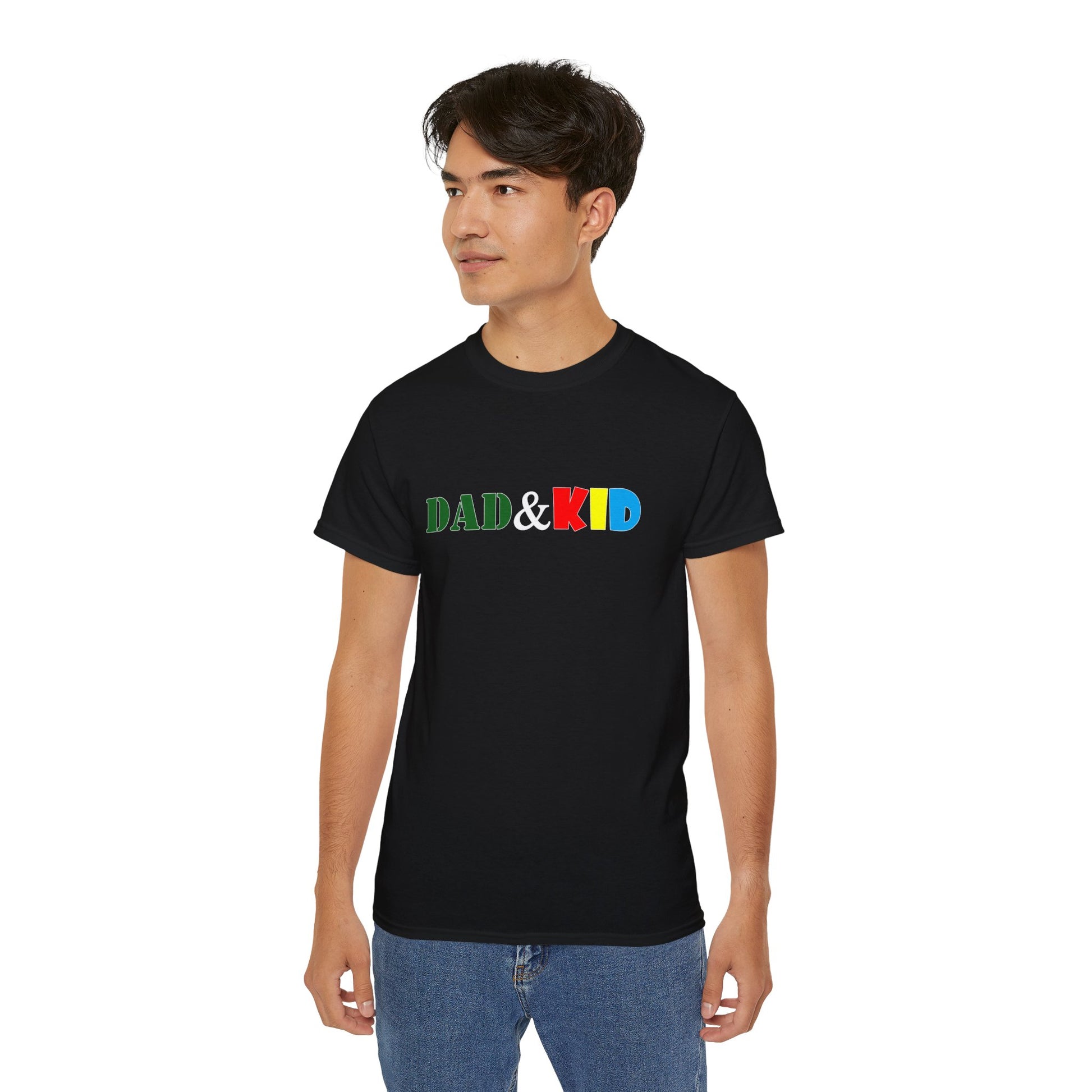 Person wearing a black t-shirt with 'DAD & KID' text in colorful letters on a white background