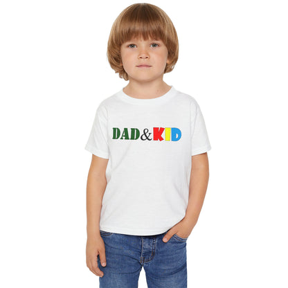 Child wearing a white t-shirt with 'DAD & KID' text in colorful letters on a white background