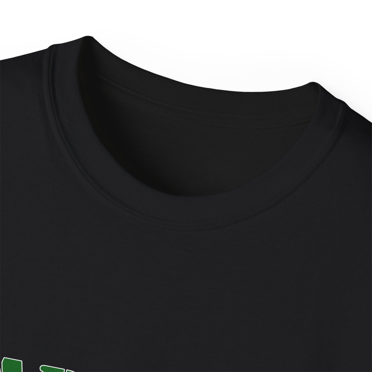 Close-up of a black t-shirt with green text on a white background