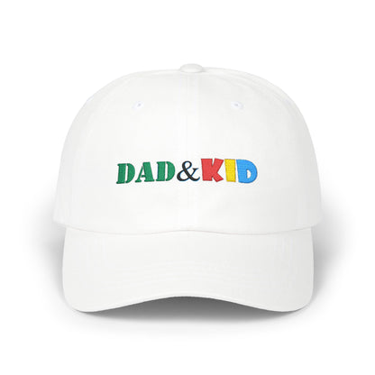 White cap with 'DAD & KID' text in colorful letters on a white background