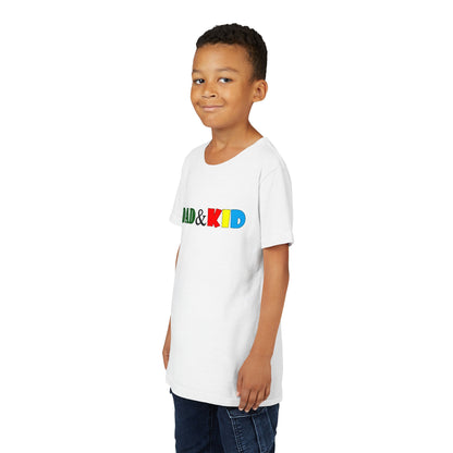 Child wearing a white t-shirt with colorful text on a white background