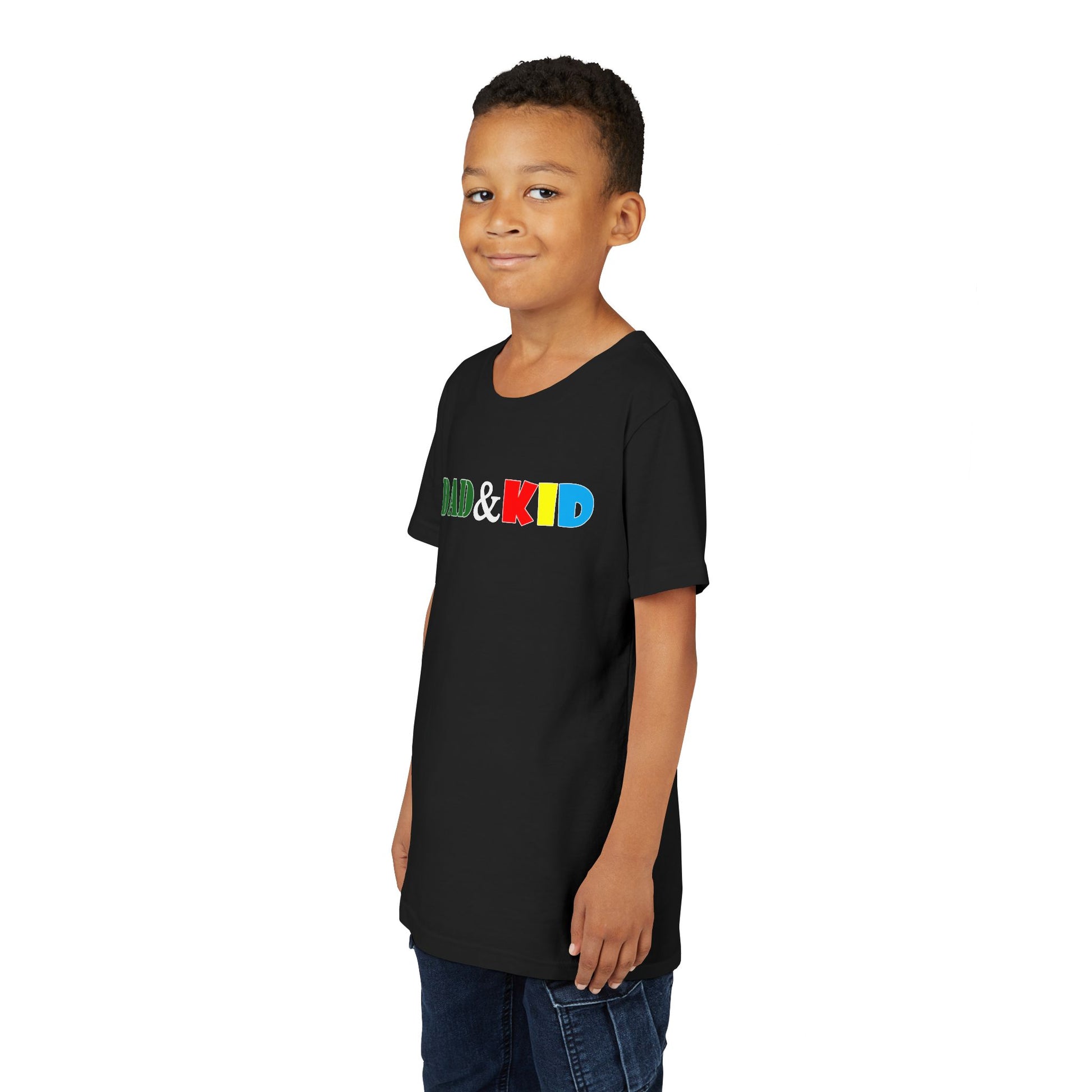 Child wearing a black t-shirt with colorful text on a white background